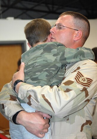 Tech. Sgt. Shawn Minard, 555th RED HORSE Squadron, embraces his 5-year-old son Zachary one last time before deploying with his unit.
(U.S Air Force Photo/Senior Airman Larry E. Reid Jr.) 