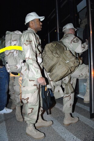 Members of the United States Air Force's 555th RED HORSE Squadron,  prepare to board a bus for their deployment March 30 in Support of Operations Iraqi and Enduring Freedom.
(U.S Air Force Photo/Senior Airman Larry E. Reid Jr.) 