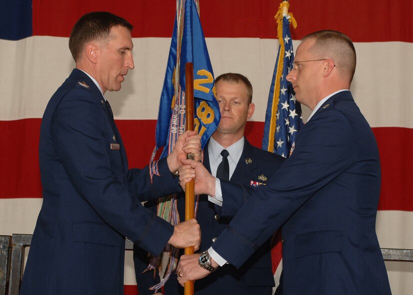 Lieutenant Col. Mark Weatherington (right) assumes command of the 28th Bomb Squadron at the change of command ceremony here March 23. Col. Scott Vander Hamm was the officiating officer, and Colonel Weatherington replaced Lt. Col. Jeffrey Taliaffero.