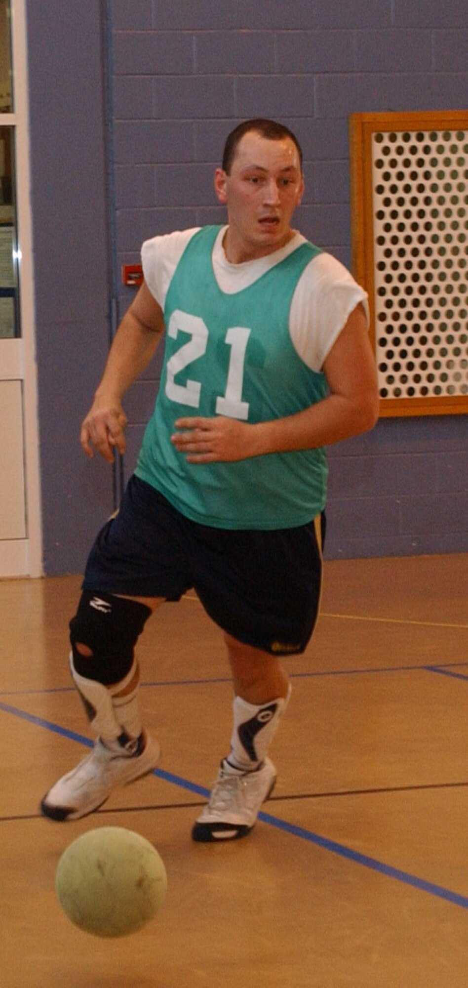 William Gaytan, 100th Logistics Readiness Squardron, is on the attack during an indoor soccer game at RAF Mildenhall's Northside fitness center April 2. (U.S. Air Force photo by Airman Brad Smith)