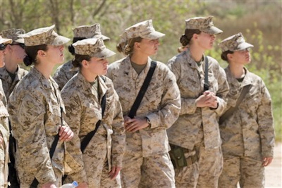 U.S. Marines and Navy sailors receive training in Al Asad, Iraq, during the Lioness Program on March 27, 2007, on various improvised explosive devices being used to attack coalition and Iraqi forces.  This program is being taught to ensure the proper care is taken while searching female Iraqis.  