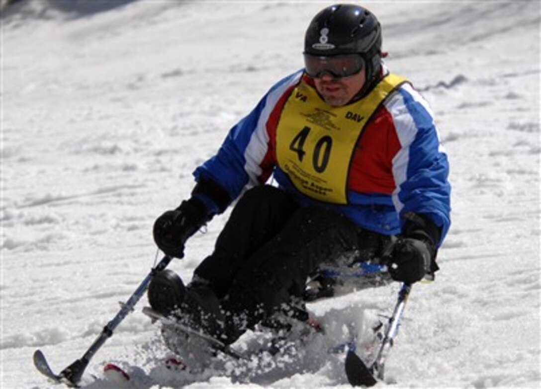Former U.S. Marine Pfc. David Bradbury, a current Veterans Affairs employee, skis downhill during the Wounded Veterans Winter Sports Clinic in Aspen, Colo., April 2, 2007. 