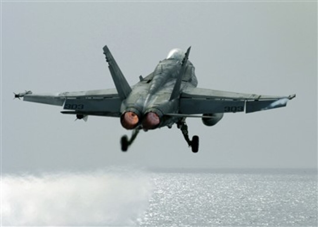 An F/A-18C Hornet aircraft takes off from the flight deck of the Nimitz-class aircraft carrier USS Dwight D. Eisenhower (CVN 69) on March 28, 2007, in the Arabian Gulf.  The Eisenhower Carrier Strike Group and Carrier Air Wing 7 are conducting a dual-carrier exercise with the USS Stennis Carrier Strike Group and Carrier Air Wing 9 during maritime security operations.  