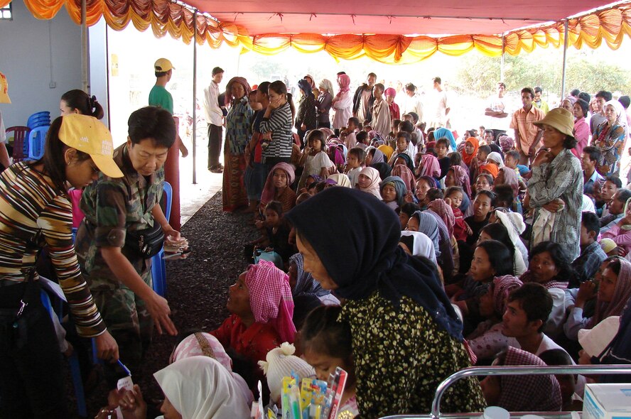 CAMBODIA - Lt Col Diep Duong, nurse and team leader with Pacific Air Forces International Health Affairs team, shown triaging the daily crowd for medical care.  Photo by John P. Spickelmier.The Pacific Air Forces International Health Specialist team left here Jan. 9 for a medical mission in Cambodia to conduct a Humanitarian Civic Assistance and Subject Matter Expert Exchange.  (Photo by John P. Spickelmier)
