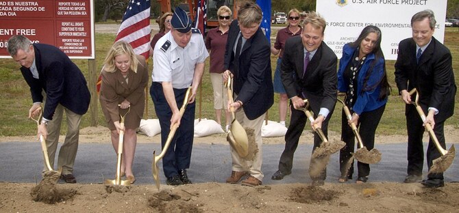 From left, Mark Perodeau, Air Force headquarters housing; Parah Fishburn from Sen. Thad Cochran’s staff; Brig. Gen. Paul Capasso, 81st Training Wing commander; Rep. Gene Taylor from Mississippi’s 4th District; Scott Walker from Sen. Trent Lott’s staff; Rosa Southard, Air Force Center for Environmental Excellence; and William Yates, president of Yates Construction Co., participate in Keesler’s military family housing groundbreaking in Thrower Park Friday.  The $287.8 million project is the largest of its kind in Air Force history.  The first block of homes is scheduled for completion in January, and the last home should be finished in three years.  Up to 1,067 homes are being built.
Photo by Herb Welch
