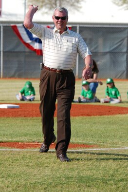 EGLIN AIR FORCE BASE, Fla. -- Skipper Kemp, Eglin Youth Center family programs flight chief, throws out the first pitch for the 2007 youth baseball season at Skipper Field April 3. Mr. Kemp, the former director of the Eglin Youth Center for 12 years, was instrumental in creating the baseball fields at Eglin 30 years ago. Skipper Field, formerly known as Field 1, was named after him five years ago in dedication of his work. This was the first time in his 30-year history at the center that Mr. Kemp has thrown out the first pitch. (U.S. Air Force photo by Staff Sgt. Mike Meares)