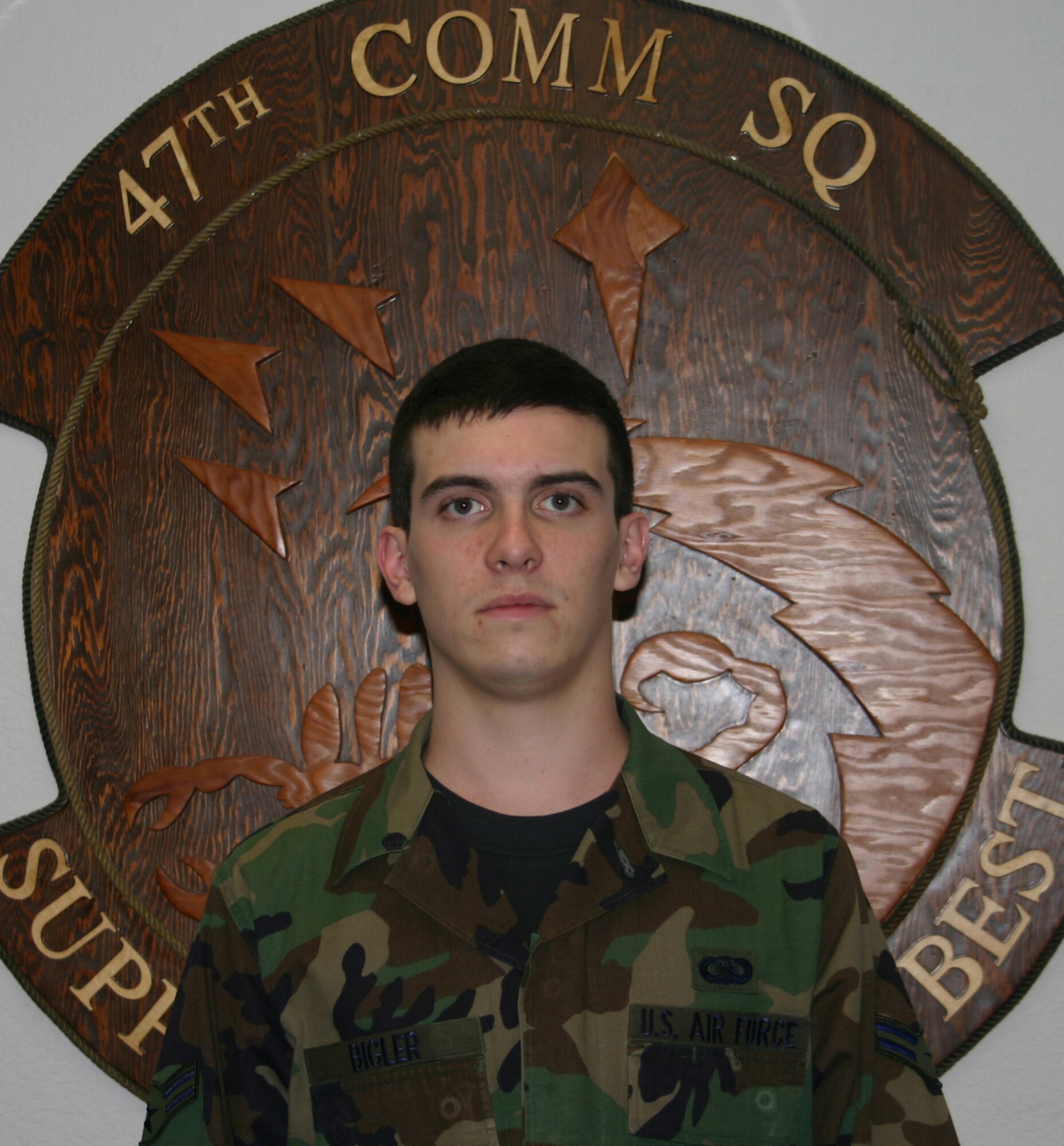 LAUGHLIN AIR FORCE BASE, Texas-- Airman 1st Class Patrick Bigler, 47th Communications Squadron, poses for a photo after the Operational Readiness Inspection out-brief here Tuesday.  Airman Bigler is one of the five Laughlin members coined by Air Education and Training Command Inspector General's team during the out brief.  (U.S. Air Force photo by Senior Airman Olufemi Owolabi)