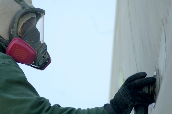Senior Airman Scott O'Shields, 315th Maintence Squadron Charleston AFB, S.C. begins the restoration process of Ol' Shakey by sanding off the old paint Monday, April 2.(U.S. Air Force photo/Staff Sgt. April Quintanilla)