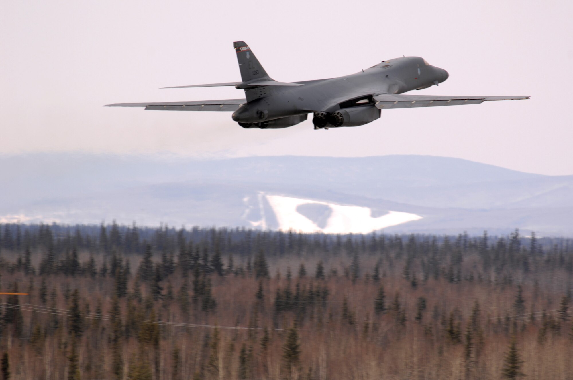 EIELSON AIR FORCE BASE, Alaska -- A B-1B Lancer from Ellsworth Air Force Base, South Dakota, performs a touch and go before landing here on April 3 for Red Flag-Alaska 07-1. Red Flag-Alaska allows aircrews to practice large-scale combat missions. The exercises are conducted on the Pacific Alaskan Range Complex with air operations flown out of Eielson and Elmendorf Air Force bases. (U.S. Air Force Photo by Staff Sgt Joshua Strang)