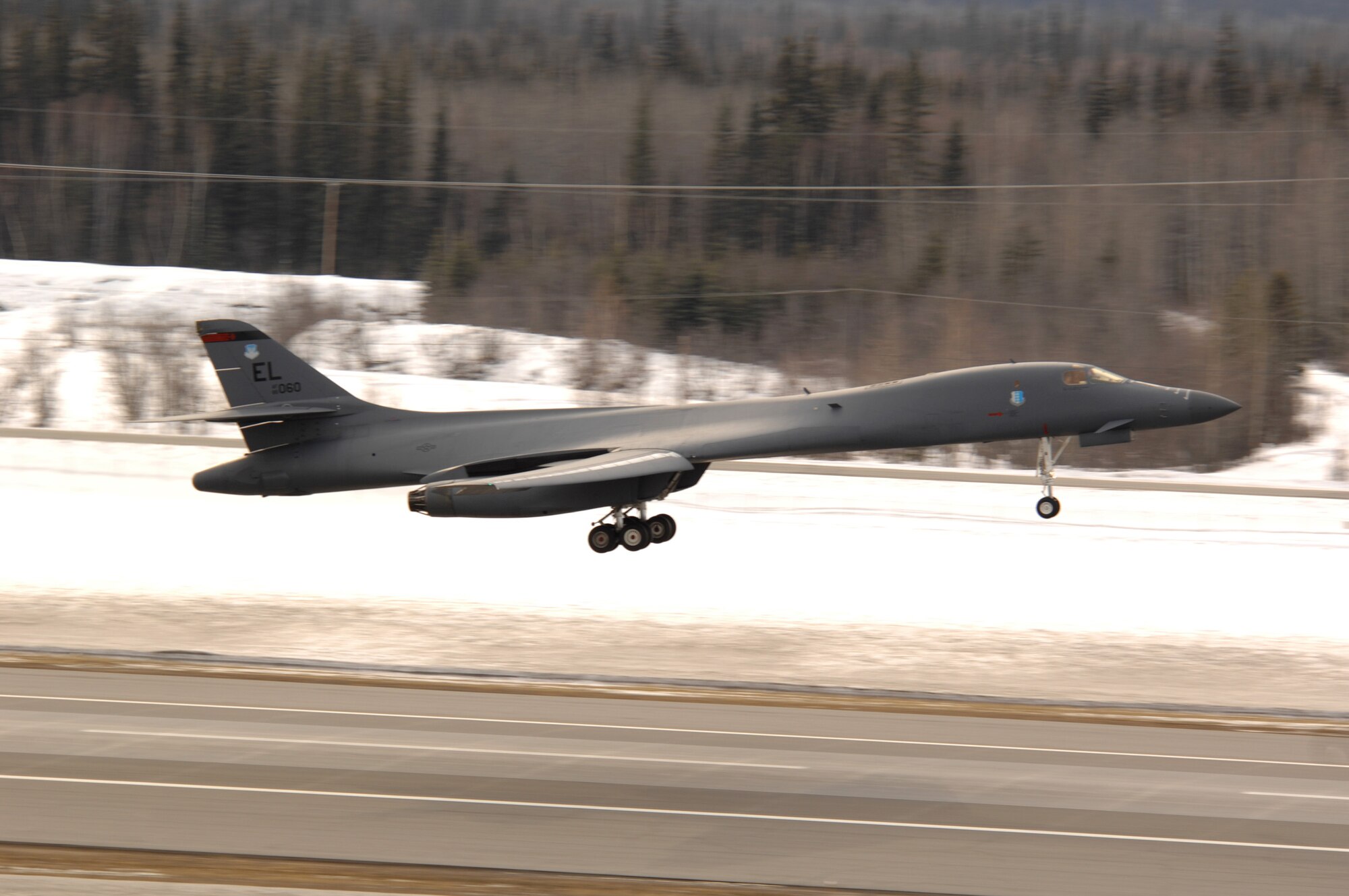 EIELSON AIR FORCE BASE, Alaska -- A B-1B Lancer from Ellsworth Air Force Base, South Dakota, performs a touch and go before landing here on Apr 3 for Red Flag-Alaska 07-1. Red Flag-Alaska, a series of Pacific Air Forces commander-directed field training exercises for U.S. forces, provides joint offensive counter-air, interdiction, close air support, and large force employment training in a simulated combat environment. 
(U.S. Air Force Photo by Staff Sgt Joshua Strang)