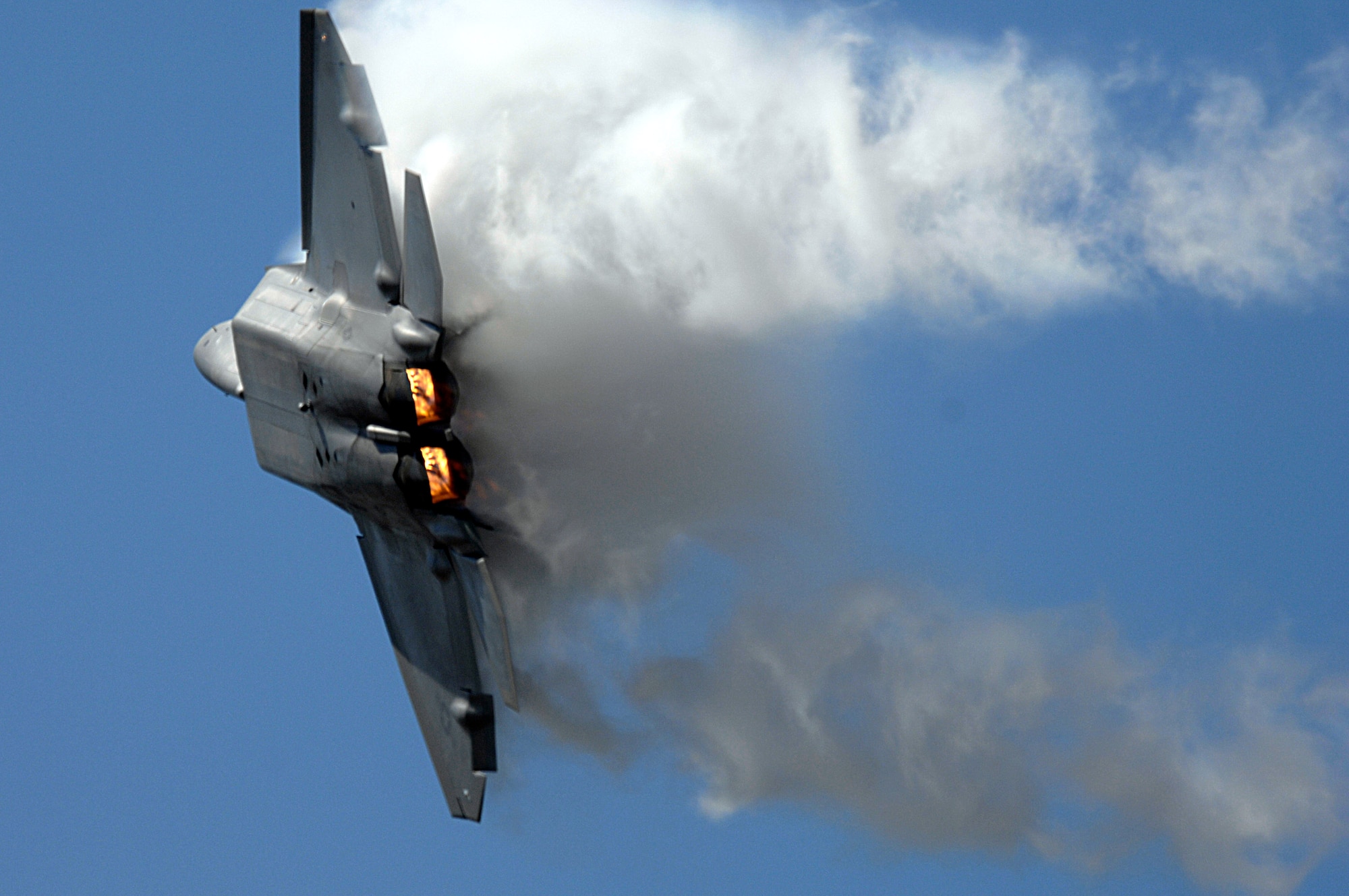 The F-22 Raptor performs for thousands during an April 1 air show at Naval Base Ventura County in Point Mugu, Calif. This F-22 is based at Langley Air Force Base, Va. The F-22 is the Air Force's newest fighter aircraft. The sophisticated F-22 aerodesign, advanced flight controls, thrust vectoring, and high thrust-to-weight ratio provide the capability to outmaneuver all current and projected aircraft. (U.S. Air Force photo/Tech Sgt Justin D. Pyle) 
