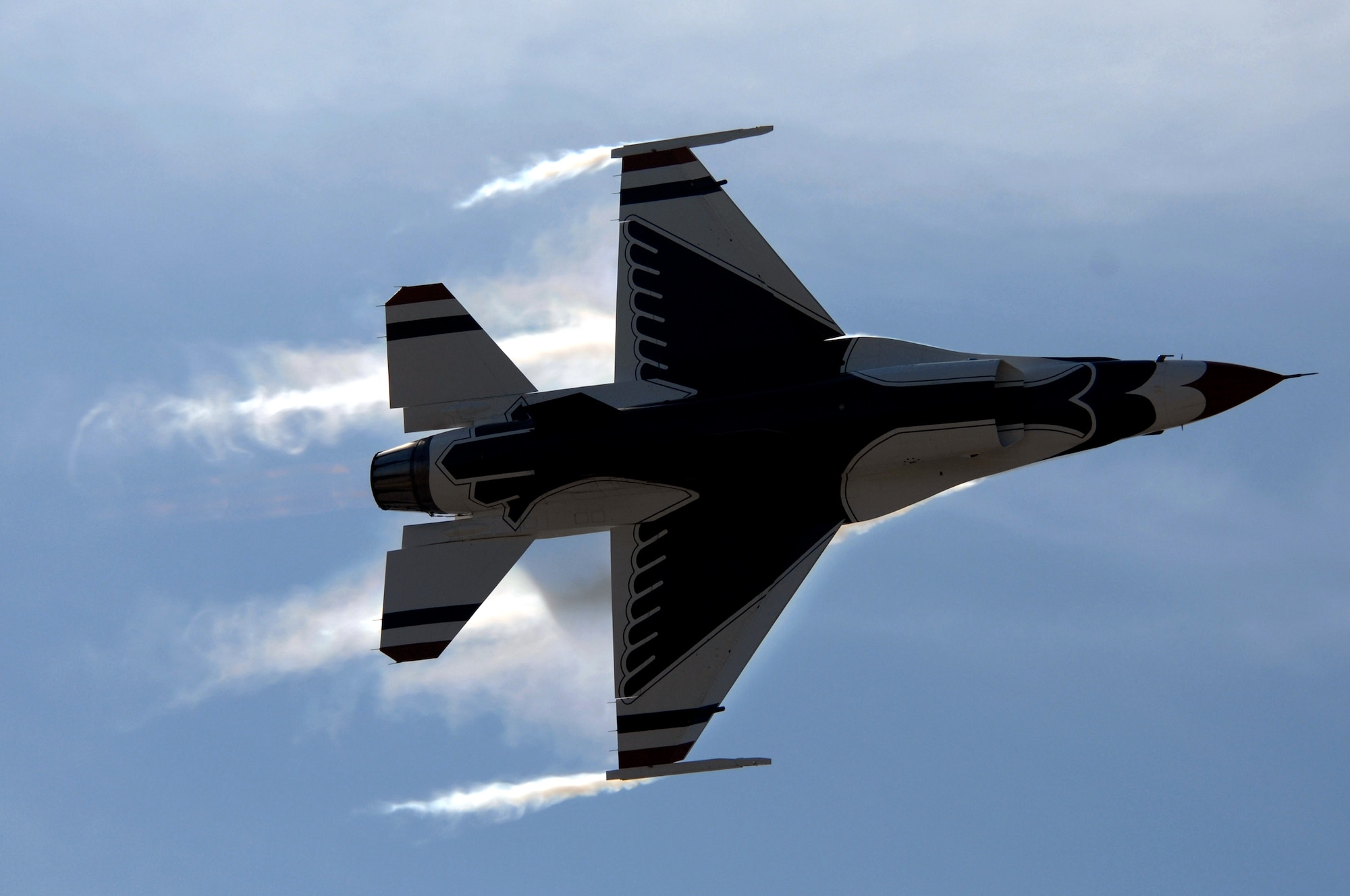 Maj. Ed Casey pulls high G's while performing the maximum 360-degree turn during the U.S. Air Force Air Demonstration Squadron, the Thunderbirds, air show April 1 at Naval Base Ventura County in Point Mugu, Calif. Captain Casey is the Thunderbirds lead solo. The four-aircraft diamond formation demonstrates the training and precision of Air Force pilots, while the solo aircraft highlight the maximum capabilities of the F-16. (U.S. Air Force photo/Tech. Sgt. Justin D. Pyle) 