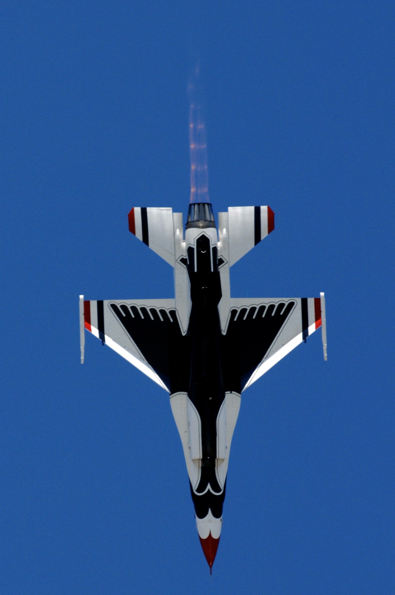 Maj. Samantha Weeks dives her F-16 Falcon straight down to show center while performing the Split S maneuver upon takeoff during the U.S. Air Force Air Demonstration Squadron, the Thunderbirds, practice show March 30 at Naval Base Ventura County in Point Mugu, Calif. Major Weeks is the opposing solo pilot on the Thunderbirds team. The Thunderbirds air demonstration is a mix of formation flying and solo routines. (U.S. Air Force photo/Tech. Sgt. Justin D. Pyle)
