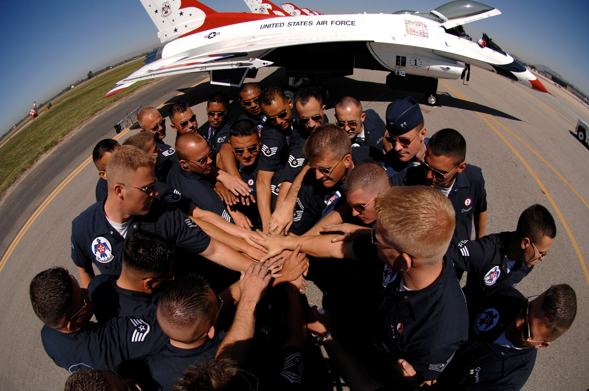 Air Force Thunderbird maintainers bring it in for a cheer after completing pre-flight checks March 30 prior to a Thunderbird practice show at Naval Base Ventura County, Point Mugu, Calif. (U.S. Air Force photo/Tech. Sgt. Justin D. Pyle)