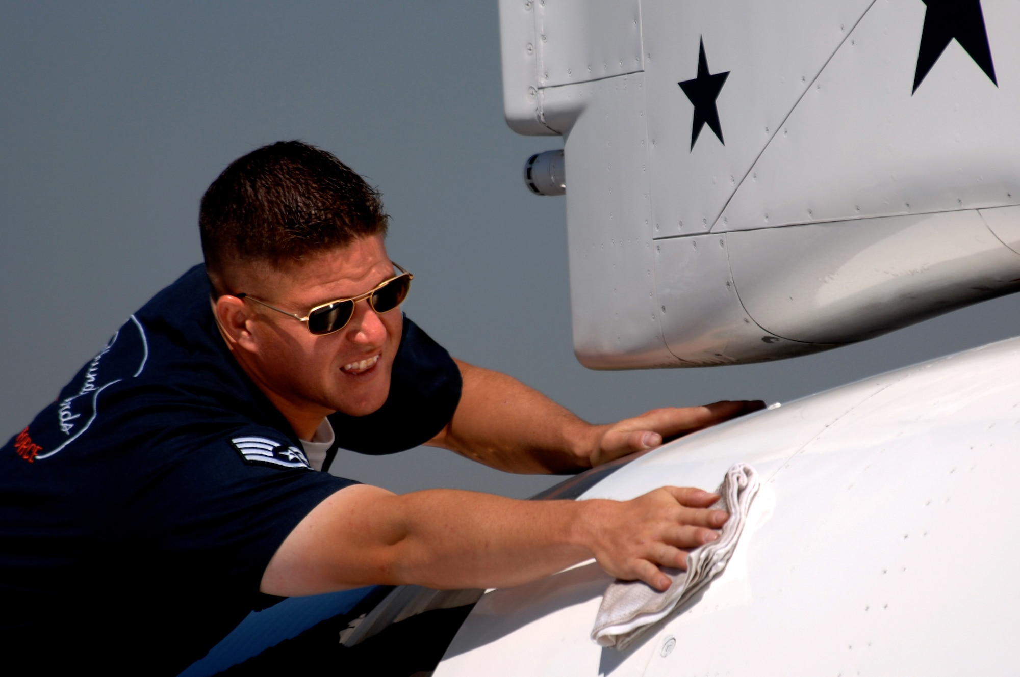 Staff Sgt. Steve Wyatt, a crew chief with the Air Force Thunderbirds, touches up one of the jets March 30 prior to a Thunderbird practice show at Naval Base Ventura County, Point Mugu, Calif.  (U.S. Air Force photo/Tech. Sgt. Justin D. Pyle) 
