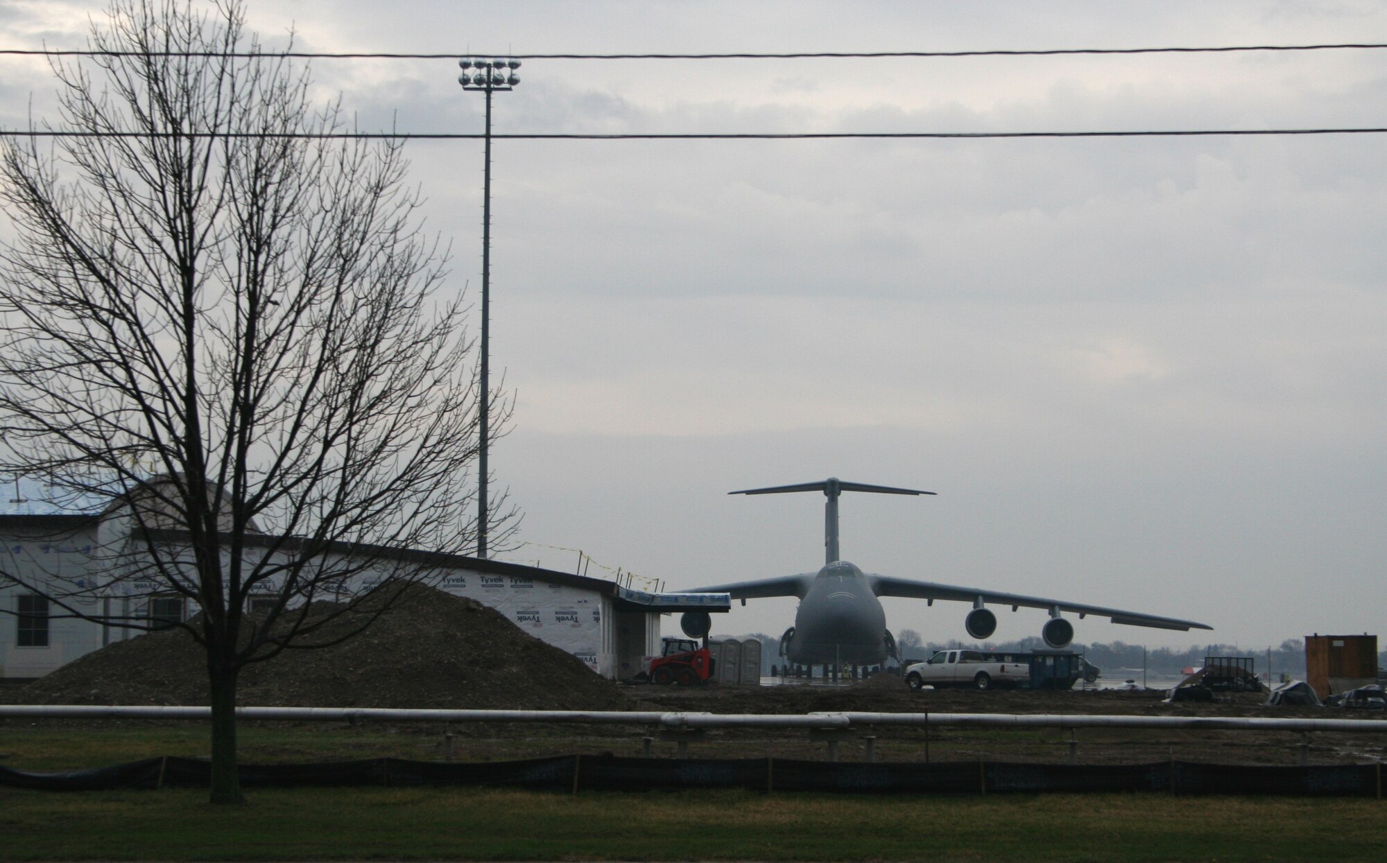 WRIGHT-PATTERSON AFB, Ohio - Construction progresses as the 445th Airlift Wing continues their conversion to the C-5 Galaxy March 23, 2007.  The wing’s new C-5 Squadron Operations Facility (shown left) will support squadron operations.  This includes aircrew, life support (maintains aircrew survival equipment), training and office space.  The facility is schedule for completion July 2007. (U.S. Air Force Photo/Laura Darden)