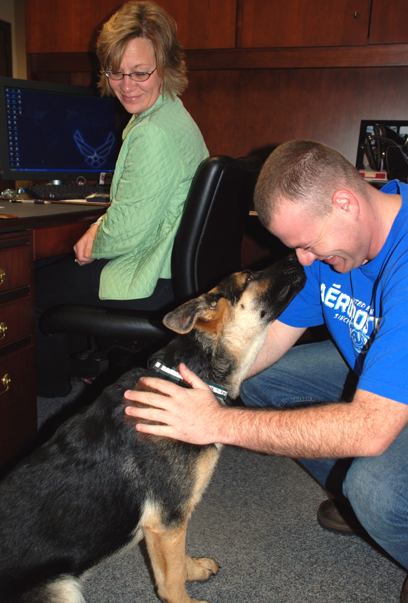Airman Tyler McGowan brings man's best friend to work to meet members of the 932nd Airlift Wing command section. 