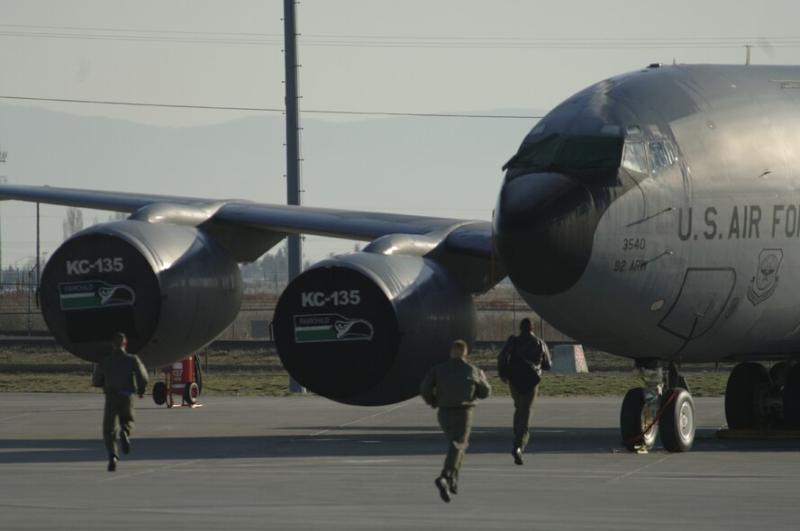 FAIRCHILD AIR FORCE BASE, Wash. – Fairchild aircrew scramble to their alert aircraft parked on the flightline. The drilling of alert procedures was in coordination with an exercise that took place here recently. (U.S. Air Force photo/Senior Airman Chad J. Watkins)