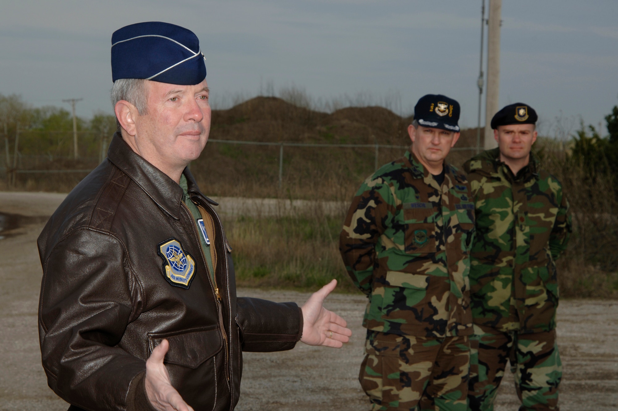Gen. Duncan J. McNabb, commander Air Mobility Command, Scott Air Force Base, Ill., addresses remarks to Airmen at McConnell Air Force Base, Kan., who participated in a combat skills and convoy training demonstration April 5, during a visit to the base with Herb Kelleher, a founder and executive chairman of Southwest Airlines, while Col. Richard Wesche, 22nd Air Refueling Wing Mission Support Group commander and Maj. Mike Green, 22nd Security Forces Squadron commander, look on. (Photo by Senior Airman Jamie Train 22nd Communications Squadron)  
