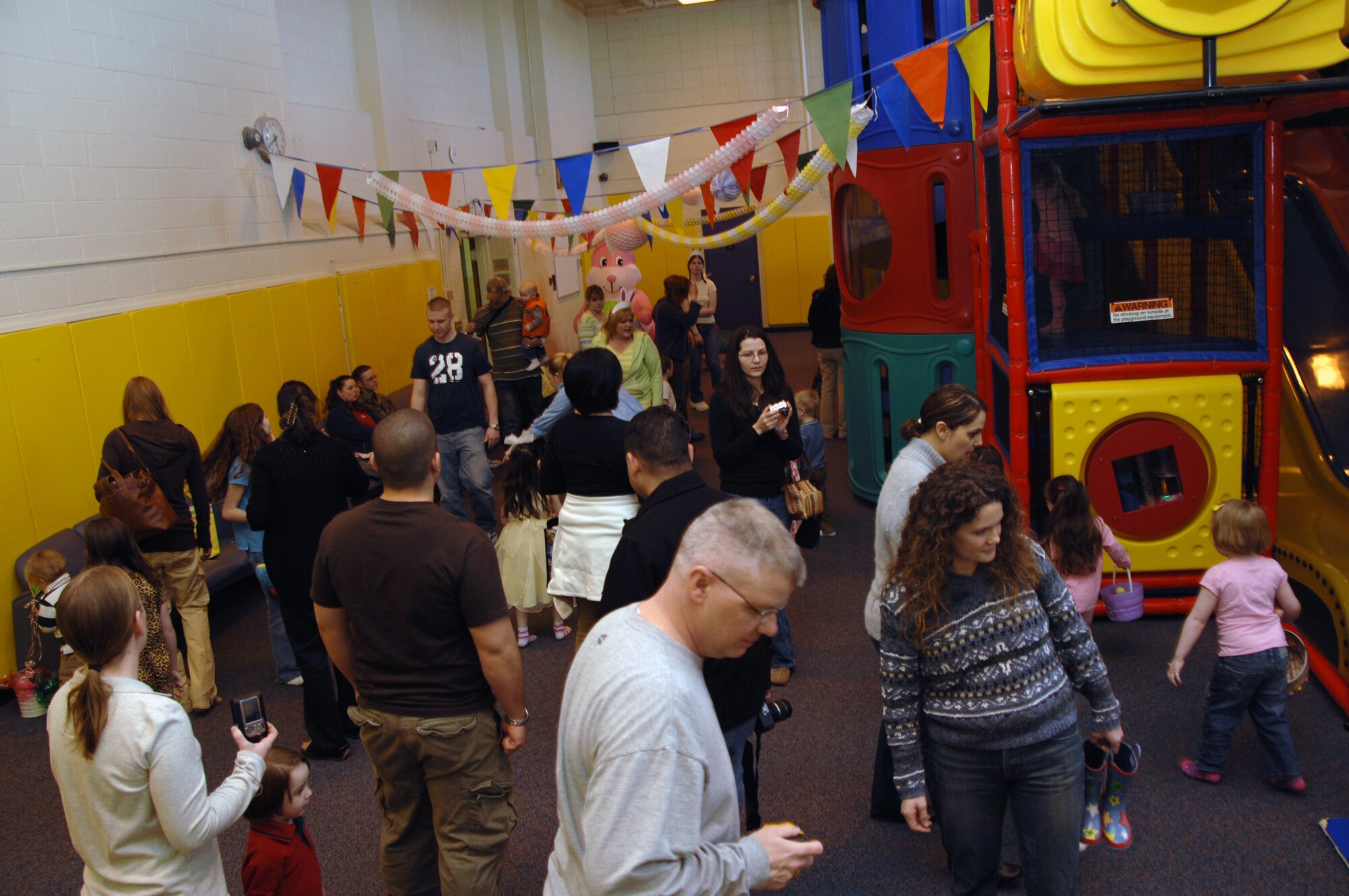 EIELSON AIR FORCE BASE, Alaska -- Parents and children search for eggs during an Easter Egg hunt at the preschool Easter party at the community center here April 5. The event consisted of games, snacks, and an Easter Egg hunt for base children.
(U.S. Air Force Photo by Staff Sgt Joshua Strang)