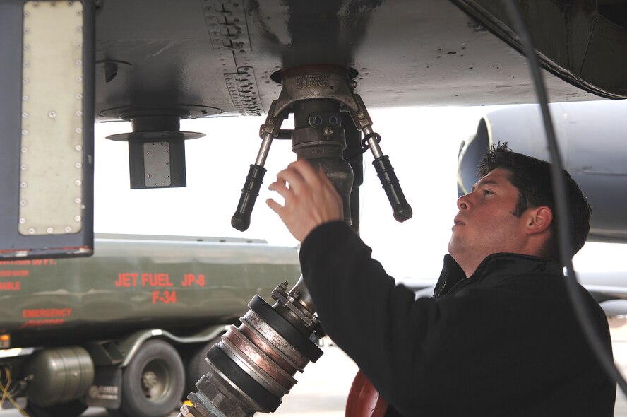 FAIRCHILD AIR FORCE BASE, Wash. – Staff Sgt. Sean Ahern, B-52 dedicated crew chief from the 2nd Aircraft Maintenance Squadron at Barksdale Air Force Base, La., refuels one of the six B-52s holding on Fairchild’s flightline this week. The aircraft were evacuated from their temporary duty location at Andersen Air Force Base, Guam, due to typhoon warnings. Now that the severe typhoon danger has passed, the B-52 crew will return to Andersen later this week. (U.S. Air Force photo by Airman 1st Class Nancy Hooks) 