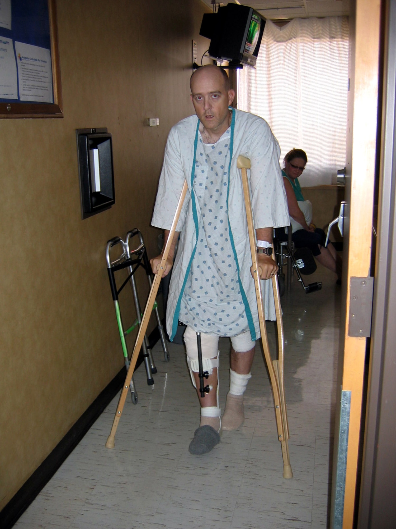 Maj. Matthew Conlan is up on his feet for the first time after being severely injured by a landmine in Afghanistan June 17, 2005. The major was on his feet by late June after receiving specialized orthopedic surgery at Wilford Hall Medical Center on Lackland Air Force Base, Texas.  (Courtesy photo)
