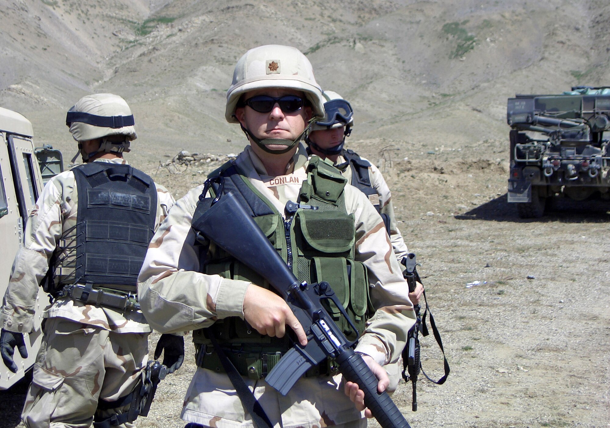 Maj. Mathew Conlan pauses for a photo prior to leaving for an explosive ordnance team mission while deployed to Bagram Air Base, Afghanistan, June 17, 2005.  Less than two hours later, Major Conlan was severely injured when a fellow team member stepped on an anti-personnel mine.  (Courtesy photo) 