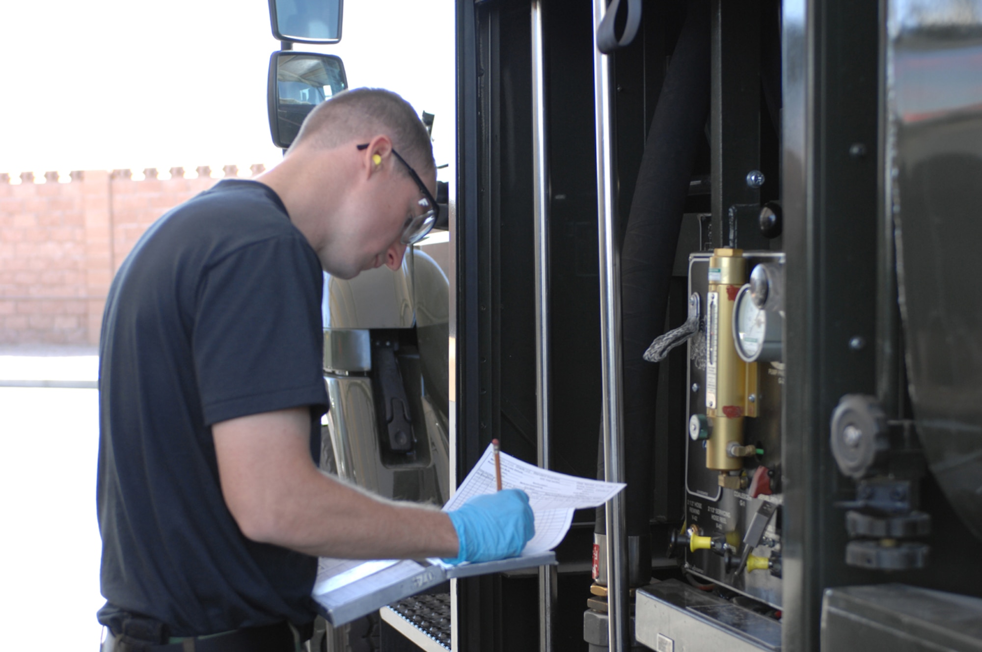 Staff Sgt. Robert Longworth 99th Logistics Readiness Squadron performs Lab by taking samples to make sure the truck is servicable (U.S. Air Force Photo/Senior Airman Jason Huddleston)