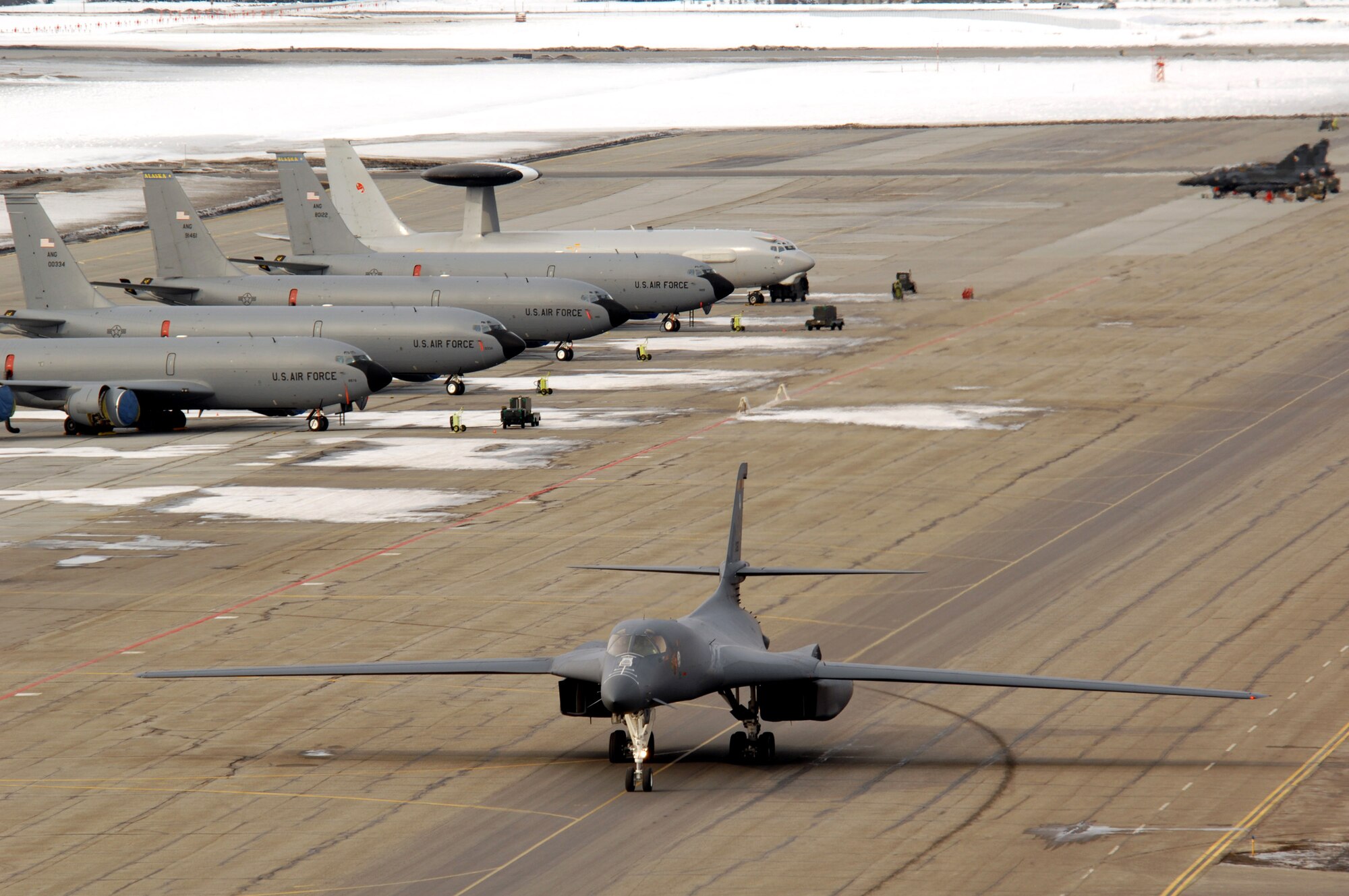 A B-1B Lancer from Ellsworth Air Force Base, S.D., taxies on the flightline while other aircraft sit on the tarmac that will participate in Red Flag-Alaska 07-1 April 3 at Eielson AFB, Alaska. These exercises are conducted on the Pacific Alaskan Range Complex with air operations flown out of Eielson and Elmendorf Air Force bases in Alaska. For the exercise, units will be made up of Air Force, Navy, French and Australian military units and organized as an air expeditionary wing at Eielson AFB with a subordinate air expeditionary group at Elmendorf AFB. (U.S. Air Force photo/Staff Sgt. Joshua Strang) 
