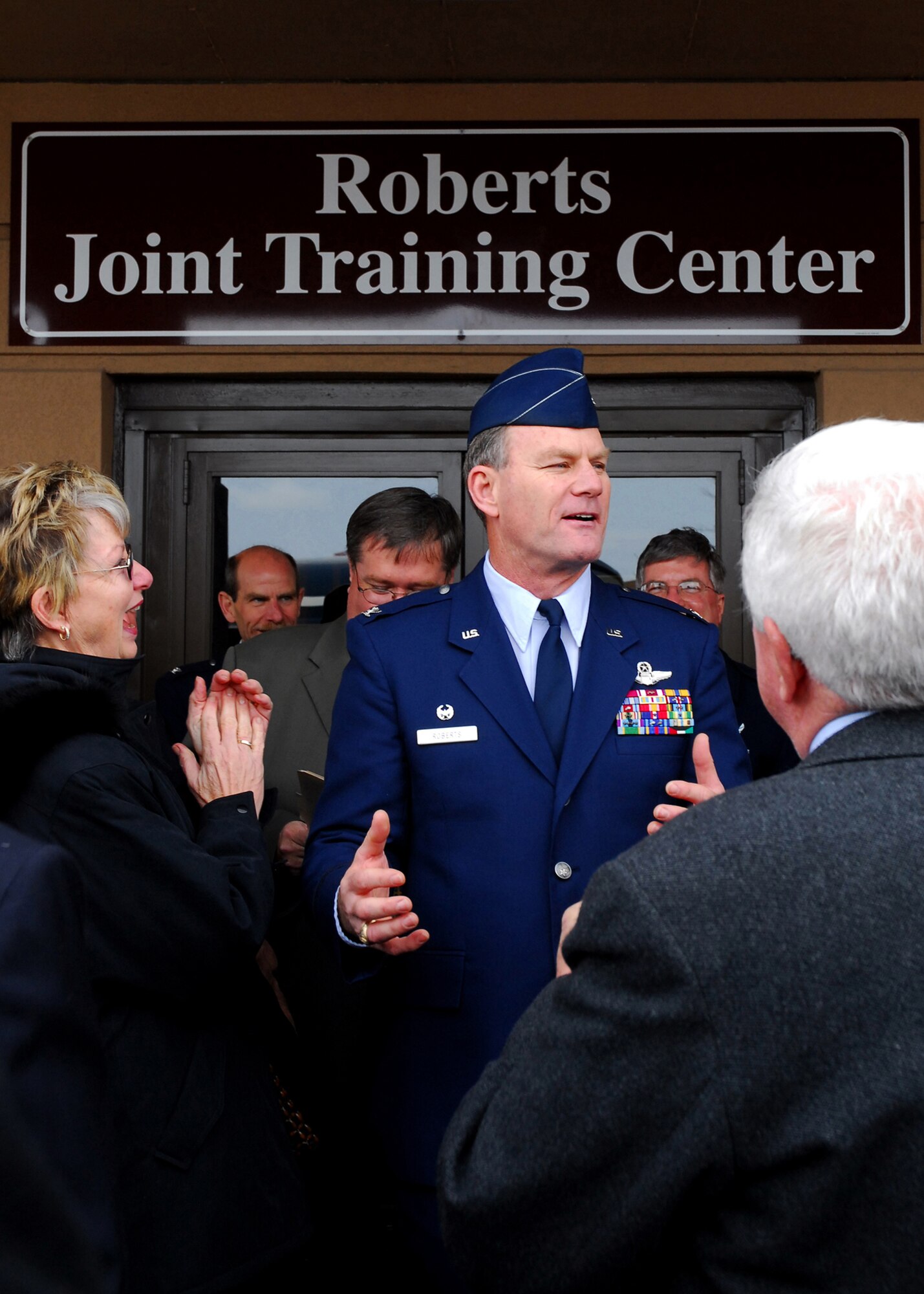 Colonel James B. Roberts addresses wellwishers after being surprised with the naming and dedication of the Roberts Joint Training Center at the Niagara Falls Air Reserve Station. (U.S. Air Force photo/Tech. Sgt. Karl C. Vester)