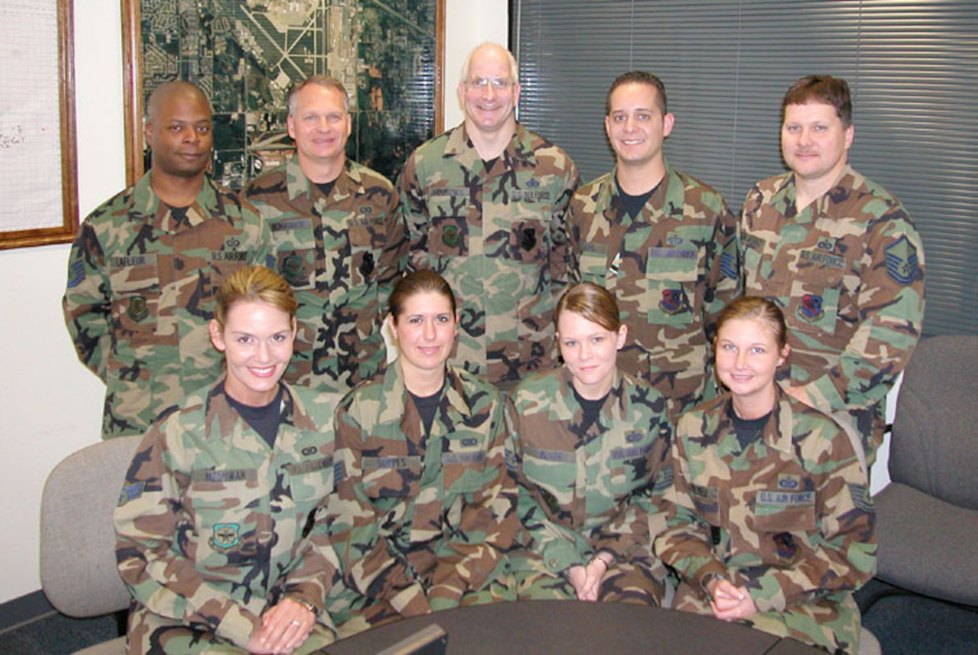 Command post controllers, pictured on front row: Senior Airman Jessica McCowan, Staff Sgts. Sarah Suppes and Geneva Black, and Tech. Sgt. Barbara Belyeu. Back row: Tech. Sgt. Paul LaFleur, Master Sgts. Christopher Bohannon, Richard Hammonds, James Rock and Mike Taliaferro. Not pictured:  Senior Airman Kimberly Goshorn and Staff. Sgt. Sara Gaddis    
                                               