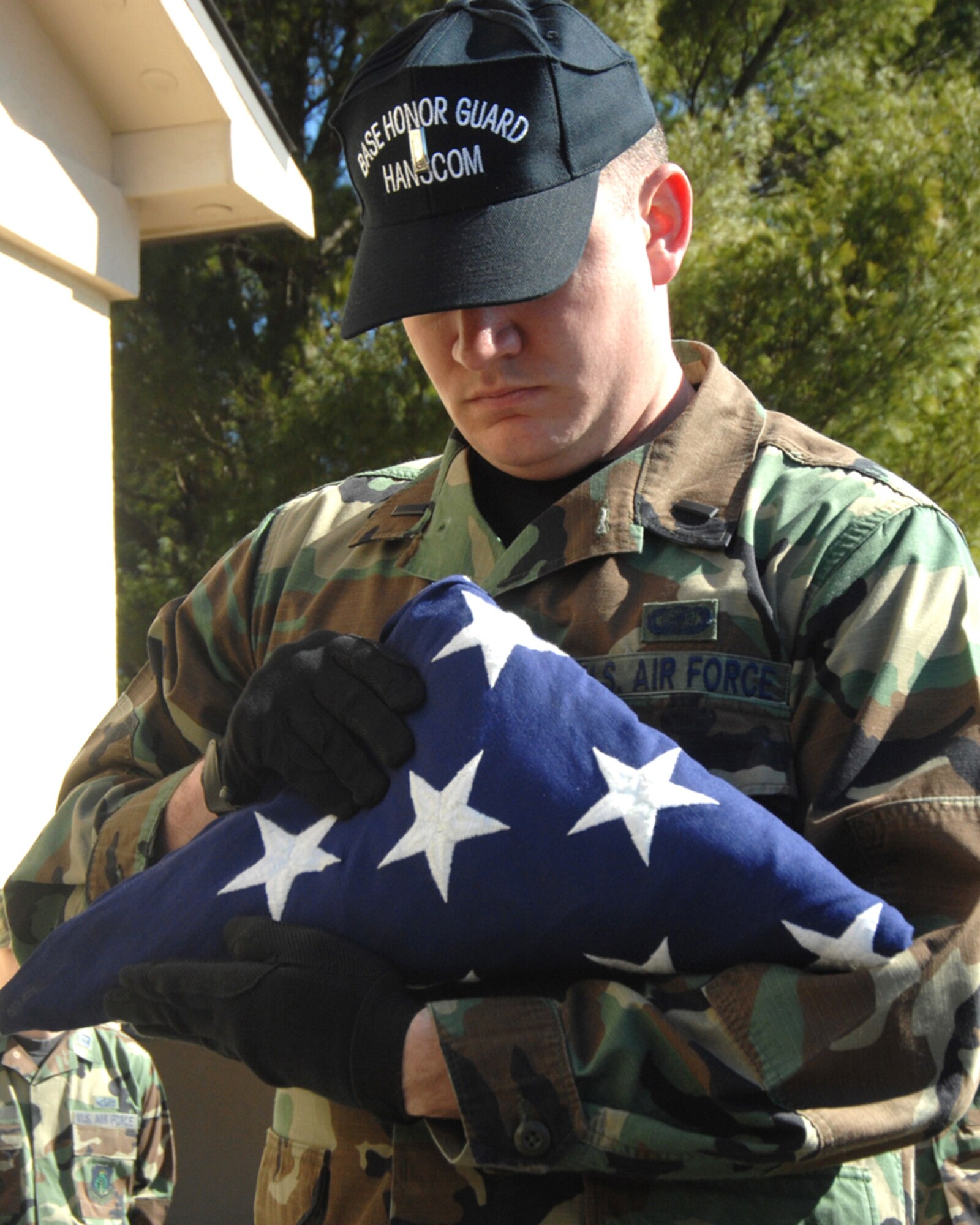 Members of the Patriot Honor Guard demonstrate procedures taken during military funeral honors. The Patriot Honor Guard participates in a variety of events including promotions, retirement ceremonies, large sports events and military funeral honors.  (US Air Force Photo by Linda LaBonte Britt)
