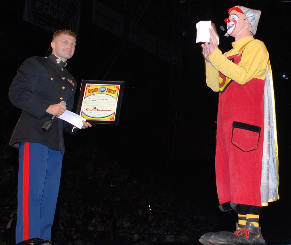 Marine 1st Lt. Matthew Hilton, left, returned to his alma mater, George Mason University, to act as honorary ringmaster at the "Greatest Show on Earth" During Ringling Brothers and Barnum and Bailey Circus’ Military Appreciation Night, April 4. Defense Dept. photo by Samantha L. Quigley