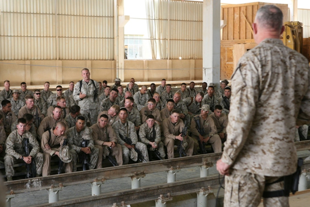 A U.S. Marine serving with Task Force 3rd Battalion, 4th Marine Regiment, ask Gen. James T. Conway, commandant of the Marine Corps a question during the commandant?s and sergeant major of the Marine Corps?,  Sgt. Maj. John L. Estrada, recent visit with Marines serving aboard Camp Al Qa?im in Al Qa?im, Iraq, April 6, 2007.  Conway and Estrada visited over 5,500 Marines and Sailors in Al Anbar Province in course of four days.  Their most stressed issue of discussion was American support of the U.S. troops serving in Iraq and support of the ongoing war on terrorism.  (Photos by Cpl. Michael S. Cifuentes)