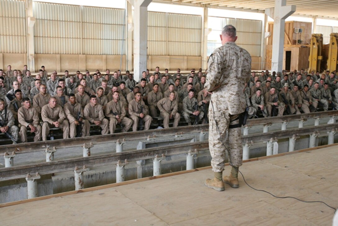 U.S. Marine Gen. James T. Conway, commandant of the Marine Corps, speaks with U.S. Marines and Sailors aboard Marine base Camp Al Qa?im in Al Qa?im, Iraq, April 6, 2007.  Conway imparted a ?hats off? to the Marines and Sailors serving in the Al Qa?im area with Task Force 3rd Battalion, 4th Marine Regiment, a Twentynine Palms, Calif.,-based battalion, during his visit to the Marines and Sailors in this western part of Iraq?s Al Anbar Province.  Sergeant Major of the Marine Corps, Sgt. Maj. John L. Estrada, accompanied Conway on his visit to the troops serving in Al Anbar Province, a 30,000 square-mile region in western Iraq where more than 5,500 Marine and Sailors serve.  Their most stressed issue of discussion was American support of the U.S. troops serving in Iraq and support of the ongoing war on terrorism. (Photos by Cpl. Michael S. Cifuentes)