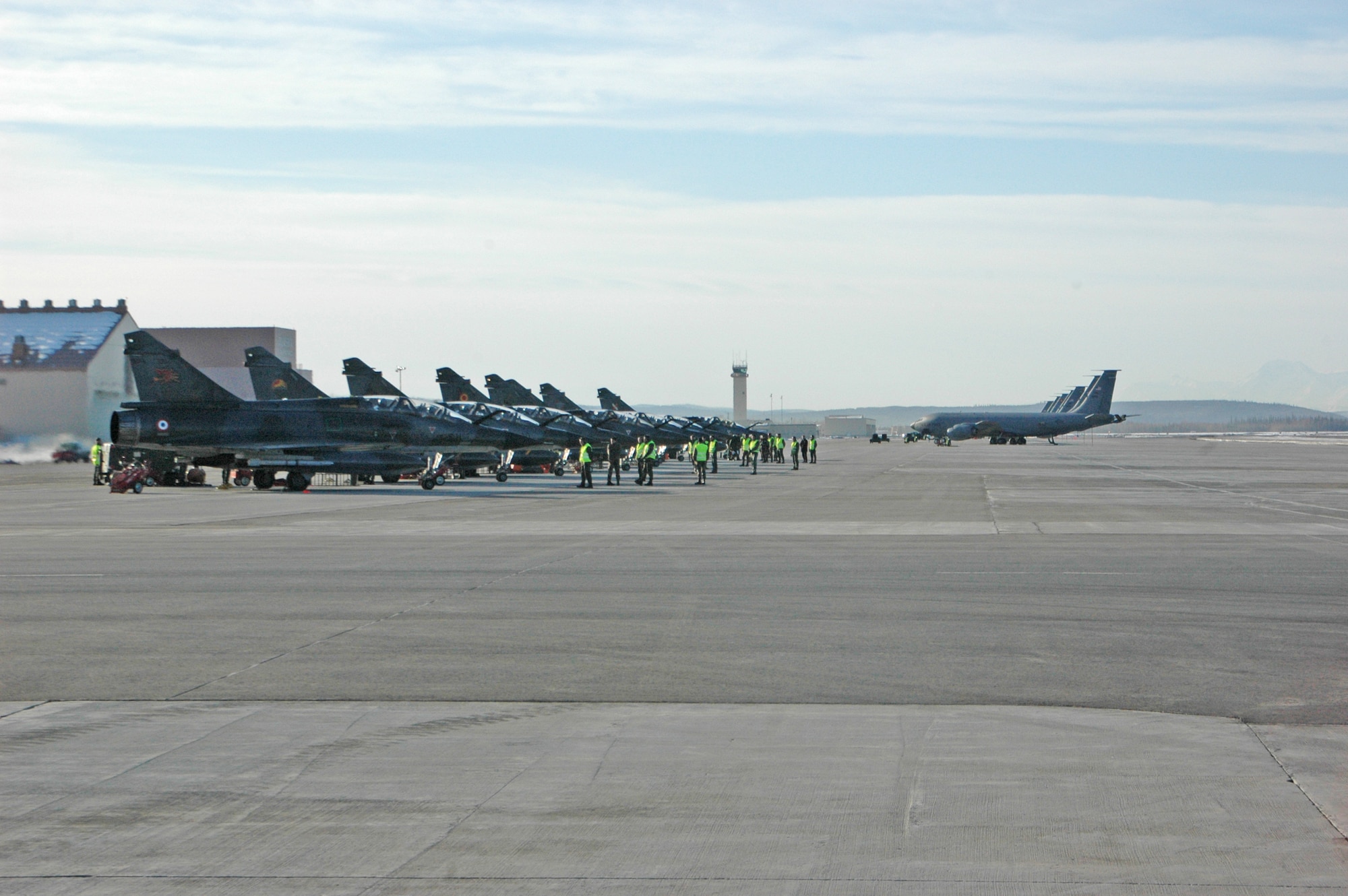 EIELSON AIR FORCE BASE, Alaska--French air force crew chiefs perform pre-flight checks Mirage 2000 jets before heading into Alaskan airspace on an orientation flight April 6. One of the many benefits to Red Flag-Alaska is the Pacific Alaska Range Complex's 67,000 square miles of airspace, one conventional bombing range and two tactical bombing ranges -- containing more than 400 different types of targets and more than 30 threat simulators both manned, and unmanned. (U.S. Air Force photo by Senior Airman Justin Weaver).