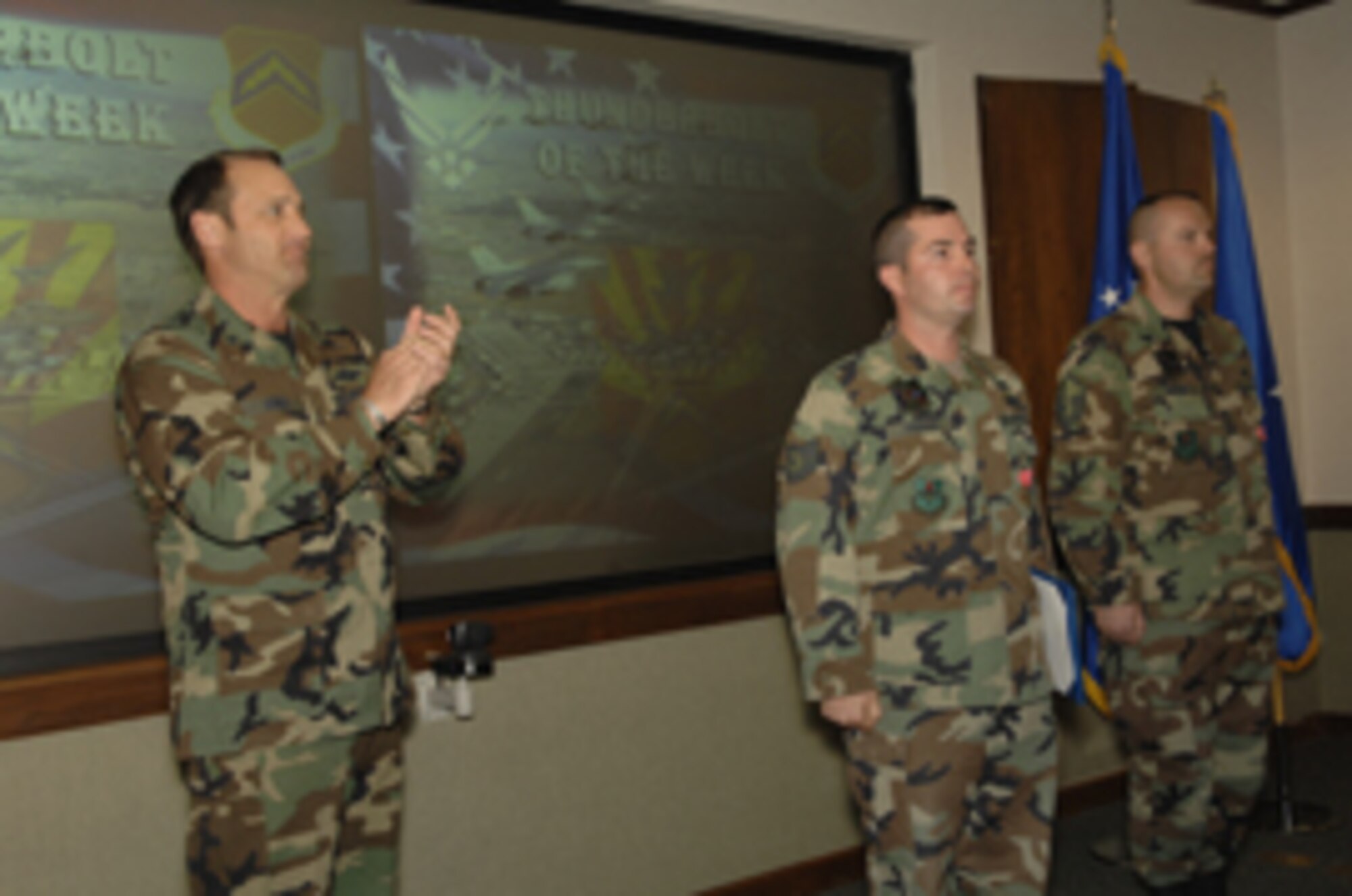 Brig. Gen. Tom Jones, left, 56th Fighter Wing commander, awarded the Bronze Star Medal to three 56th Civil Engineer Squadron Airmen in a ceremony Monday at the base theater.  Pictured at wing standup are Tech. Sgt. Vincent Pagano, center, and Master Sgt. Randall Kinser Jr. Also receiving the medal was Tech. Sgt. Gary Gibson, not pictured. (Photo by Master Sgt. William Gomez)