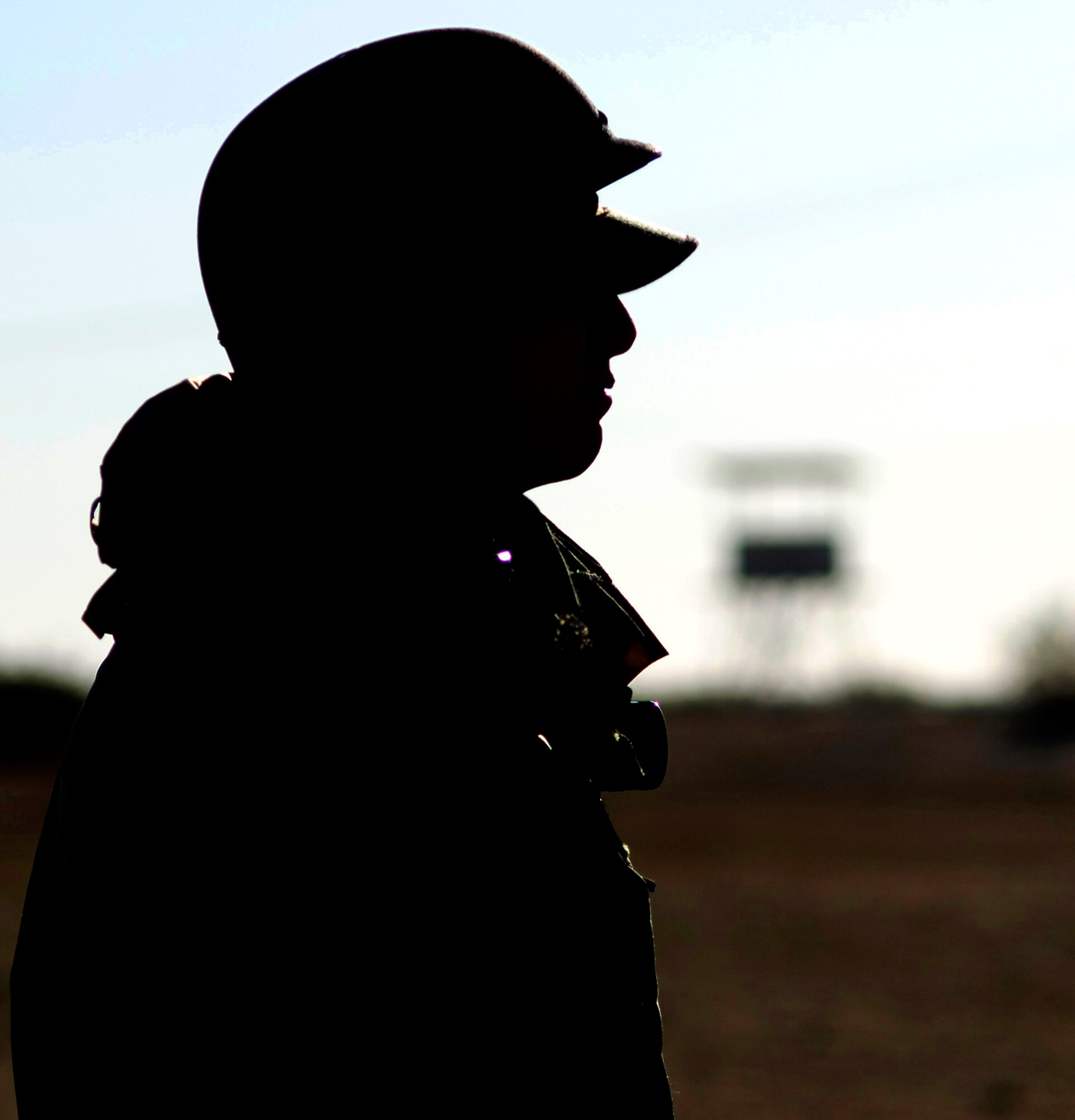 An Airman observes his surroundings during the combat skills training at Camp Corum here March 28 through 30. (Photo by Mike Cassidy)