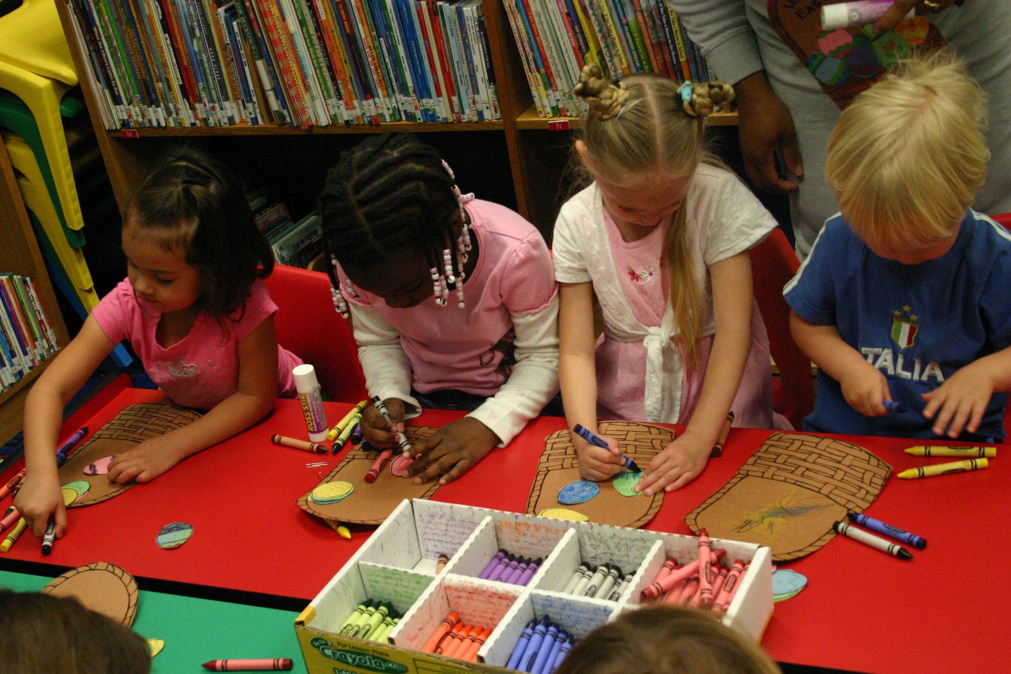 LAUGHLIN AIR FORCE BASE -- Children from base color thier Easter crafts after story time at the base library Friday. 