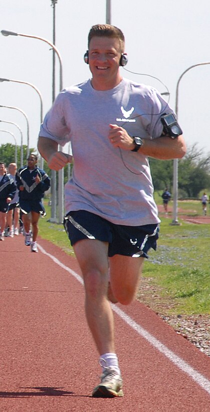 A Team Sheppard member makes his way around the 1-mile track April 4 during the 82nd Training Wing run. In addition to the run, participants also completed the required push ups and sit ups. (U.S. Air Force photo/Mike Litteken)