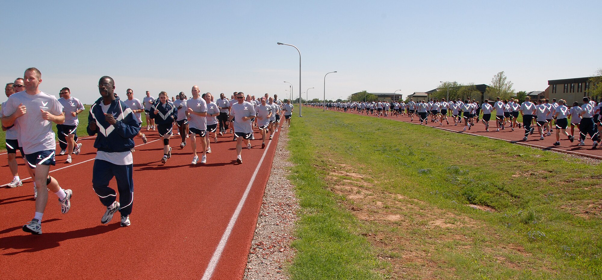 Hundreds of 82nd Training Wing personnel make their way around the 1-mile track April 4 during the wing's monthly run. Participants also completed sit ups and push ups. (U.S. Air Force photo/Mike Litteken)