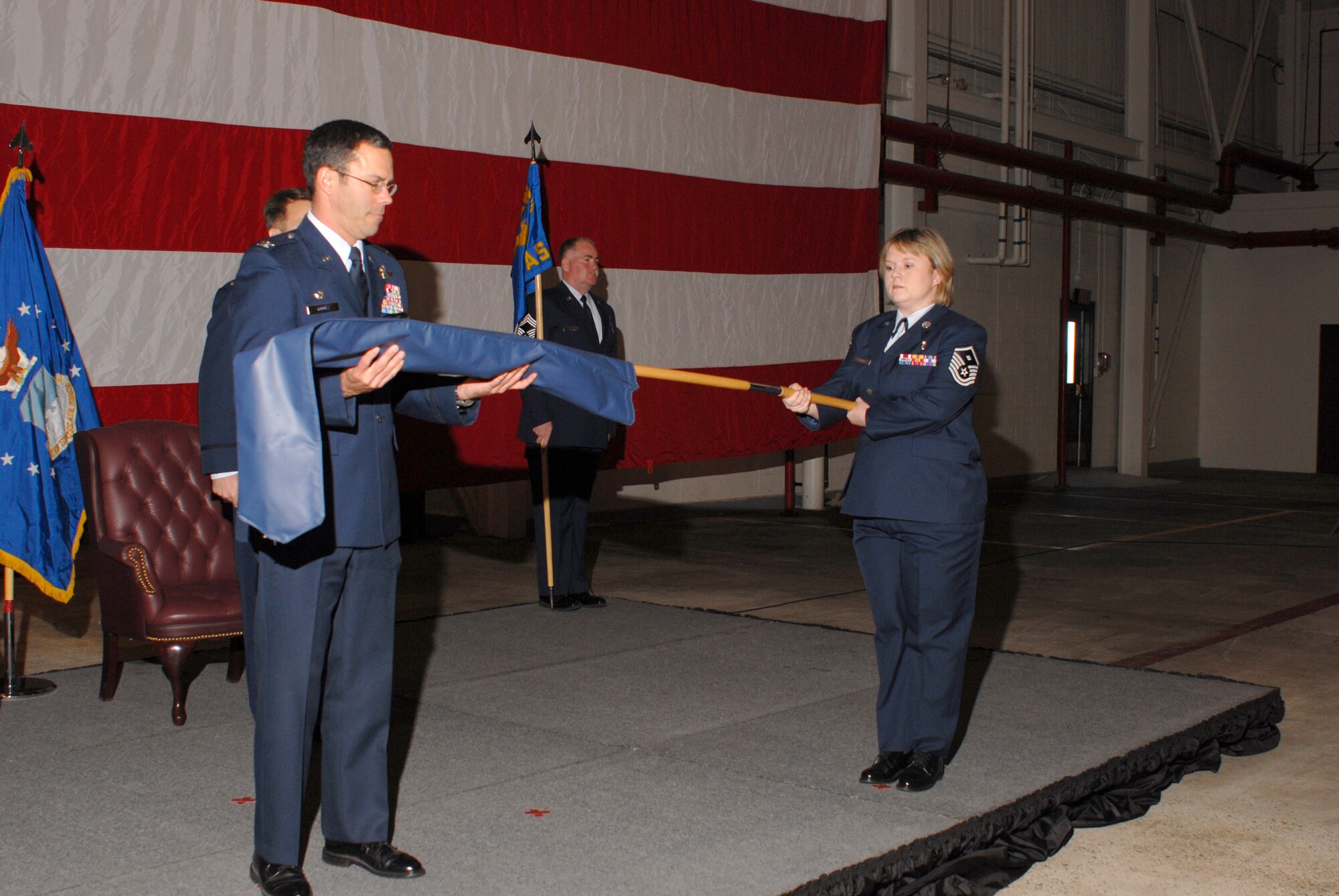 The new 41st Airlift Squadron guidon is unveiled in an April 6 ceremony at Little Rock Air Force Base, Ark. The 41st AS will bring 155 Airmen here employing 16 C-130J Hercules aircraft. (U.S. Air Force photo/Airman 1st Class Christine Clark)
