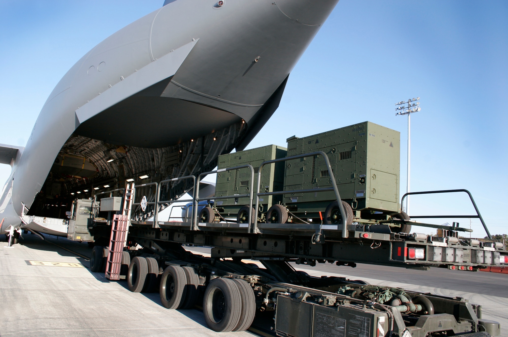 A C-17 Globemaster III is ready to receive two generators off a 60,000 pound loader during the Crisis Look 07-02 deployment exercise held on Travis Air Force Base, Calif. (U. S. Air Force photo Laura Fentress)