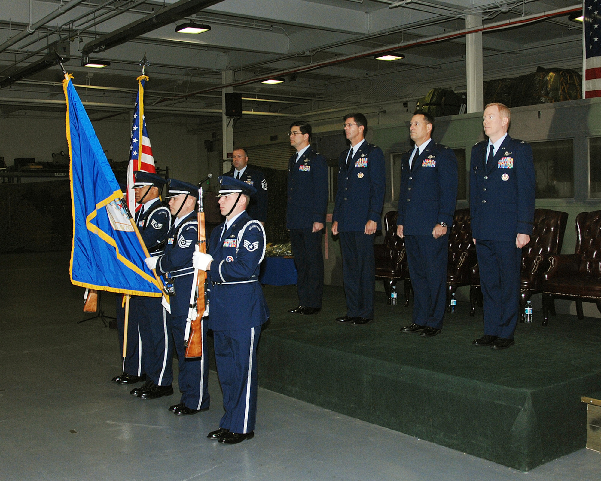 Travis Air Force Base Honor Guard presents the flag during the 615th Contingency Operational Support Group wing stand up.