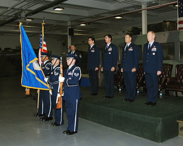 Travis Air Force Base Honor Guard presents the flag during the 615th Contingency Operational Support Group wing stand up.