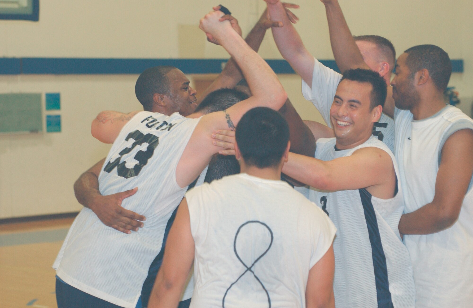 MCCHORD AIR FORCE BASE, Wash.-- Members of the 62nd Medical Group's intramural basketball team celebrate after defeating the 62nd Maintenance Squadron 43-37 in the championship game March 30 at the fitness center. (U.S. Air Force Photo by Tyler Hemstreet)