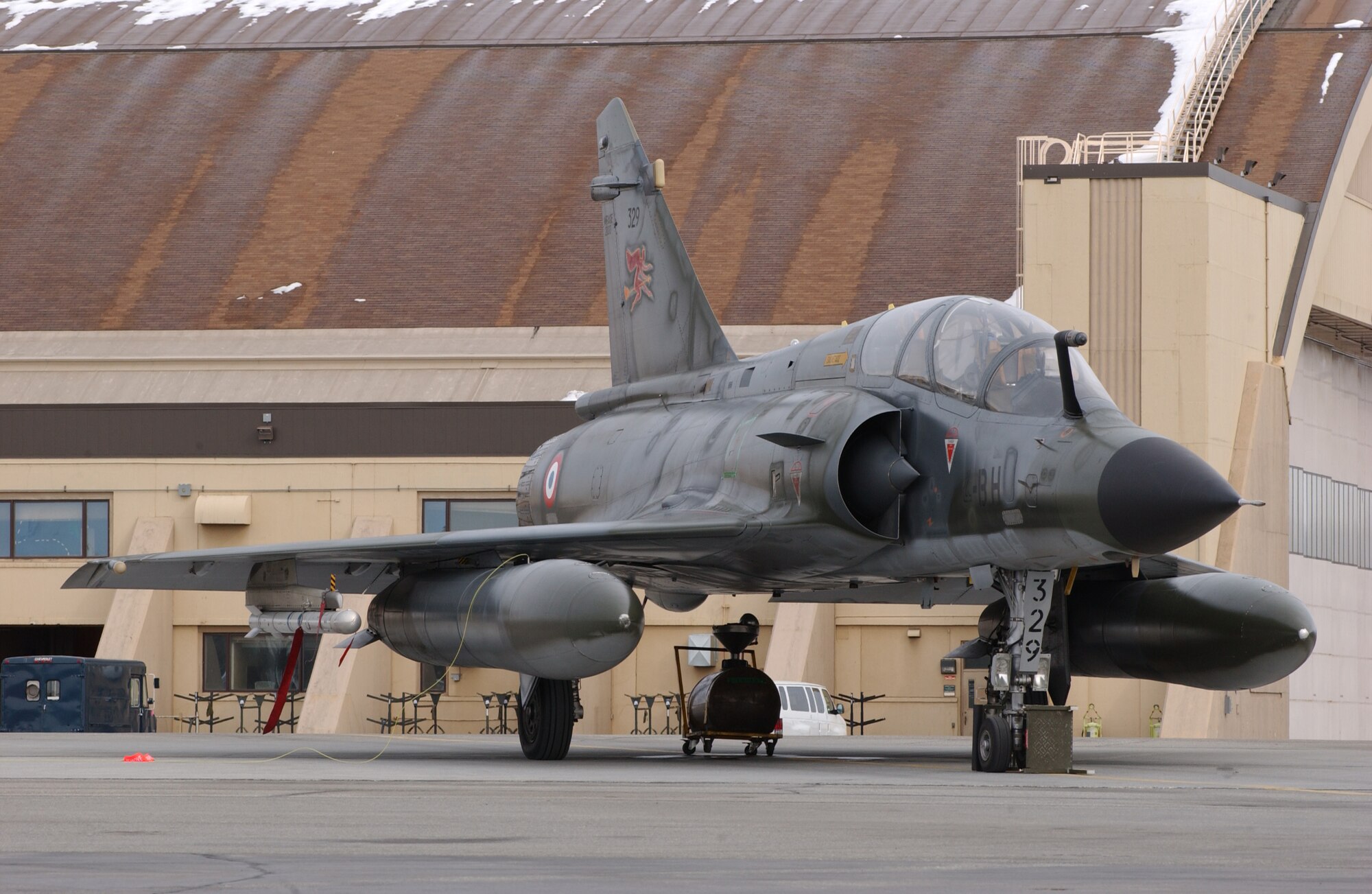 EIELSON AIR FORCE BASE, Alaska -- The French Air Force, Armee de l'Air, Dassault Mirage 2000 sits in front of the Thunderdome on April 3 for Red Flag-Alaska 07-1. Red Flag-Alaska is a Pacific Air Forces-directed field training exercise for U.S. forces flown under simulated air combat conditions.  It is conducted on the Pacific Alaskan Range Complex with air operations flown out of Eielson and Elmendorf Air Force Bases. (U.S. Air Force Photo by Airman 1st Class Jonathan Snyder) (Released)