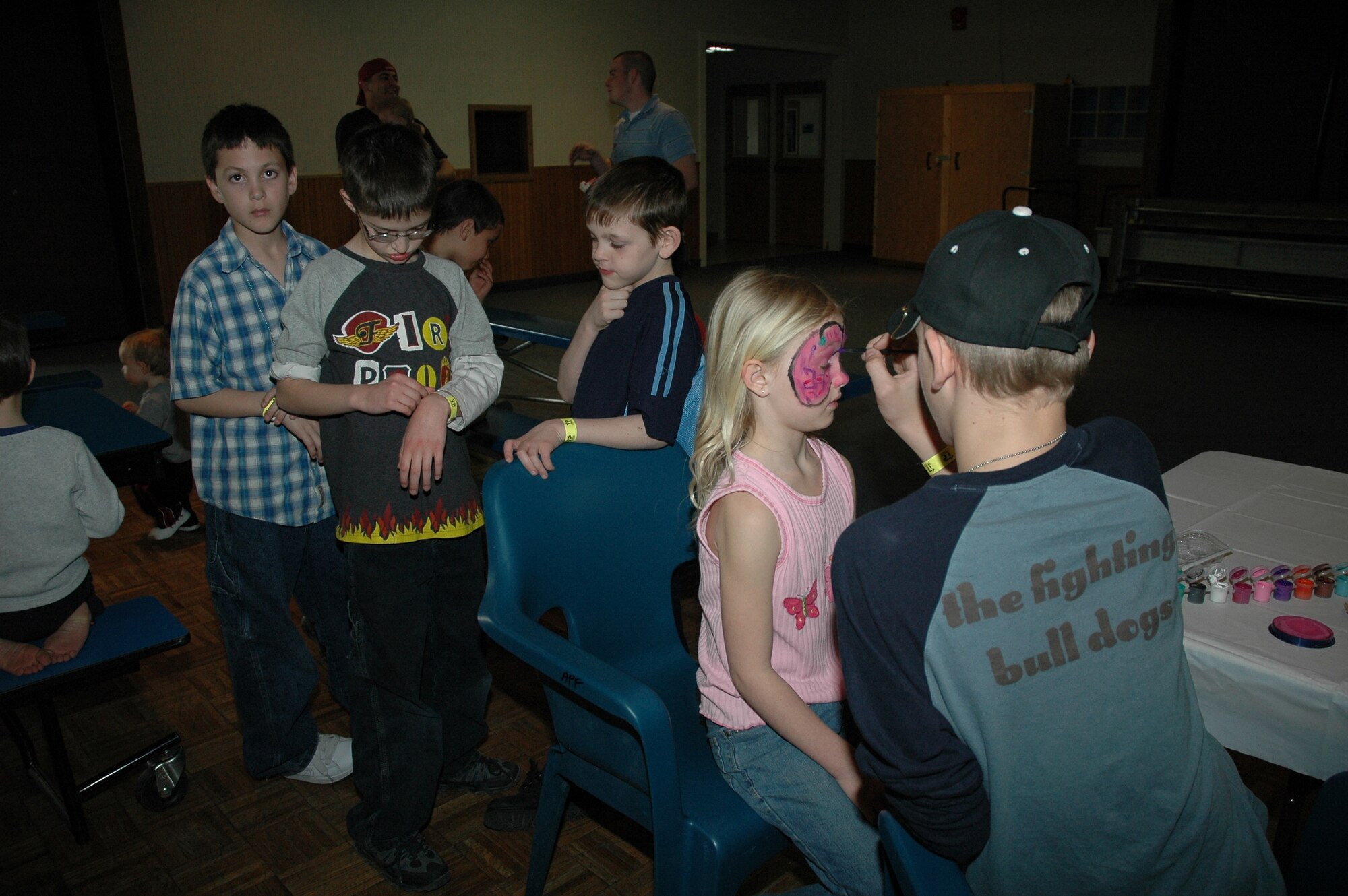 Little Warriors wait in line at the face-painting booth. 