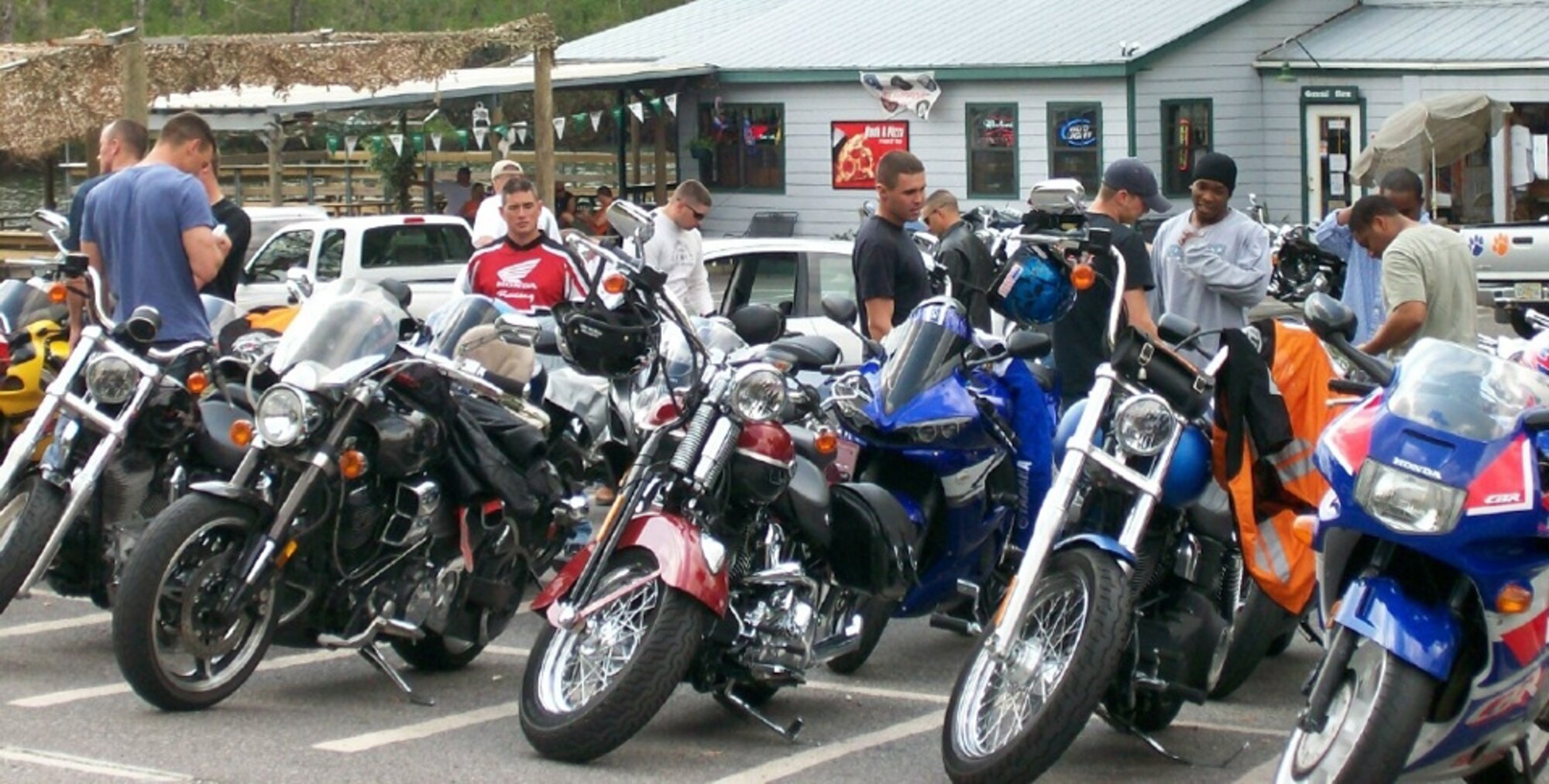 Airmen from the 823rd RED HORSE Squadron take a break during the poker run March 30. The squadron held the 118-mile run to better educate the less experienced riders on motorcycle safety in various terrains. (U.S. Air Force photo by Jamie Haig)