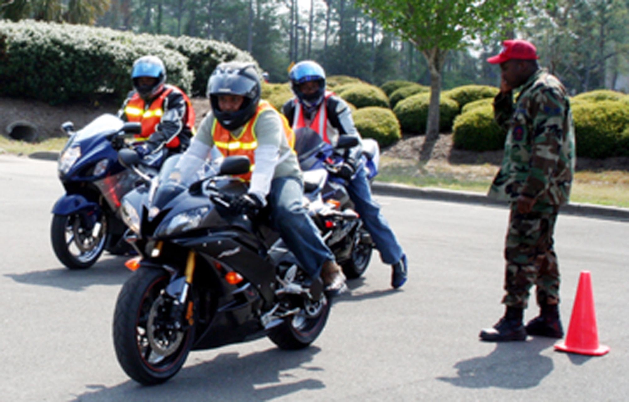 Airmen from the 823rd RED HORSE Squadron roll out to start the motorcycle safety poker run March 30. The squadron held the 118-mile run to better educate the less experienced riders on motorcycle safety in various terrains. (U.S. Air Force photo by Jamie Haig)